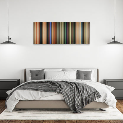 Happy Death Day color palette canvas above a bed, between two black pendant lamps