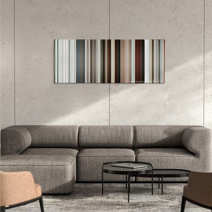 Rango color palette canvas on a concrete wall above a gray sectional sofa
