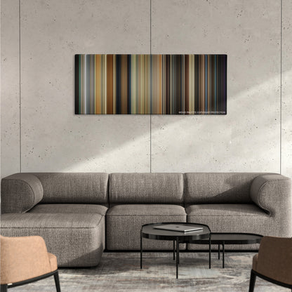 Get Out color palette canvas on a concrete wall above a gray sectional sofa