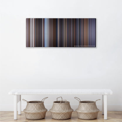 The World Is Not Enough color palette canvas above a white bench with three woven baskets
