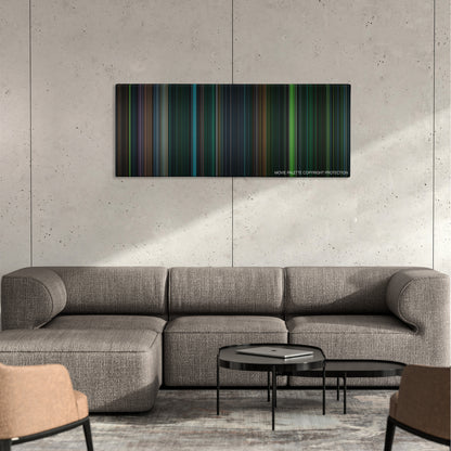 Saw V color palette canvas on a concrete wall above a gray sectional sofa