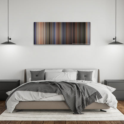 Twister color palette canvas above a bed, between two black pendant lamps