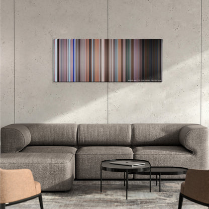 Elf color palette canvas on a concrete wall above a gray sectional sofa
