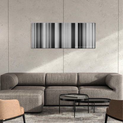 The Treasure of the Sierra Madre color palette canvas on a concrete wall above a gray sectional sofa
