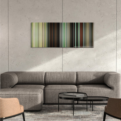 Atonement color palette canvas on a concrete wall above a gray sectional sofa