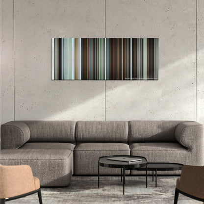 Manchester by the Sea color palette canvas on a concrete wall above a gray sectional sofa