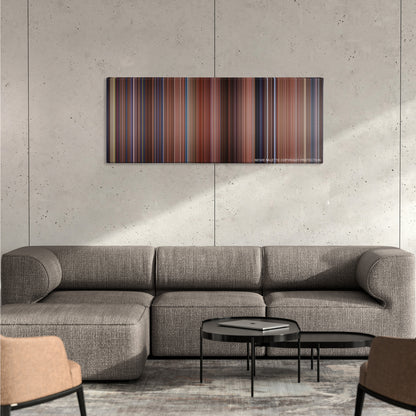 Hook color palette canvas on a concrete wall above a gray sectional sofa