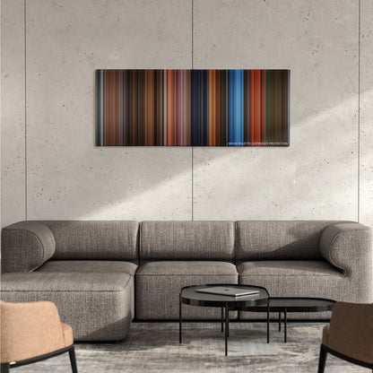 The Phantom of the Opera color palette canvas on a concrete wall above a gray sectional sofa