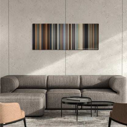 Crash color palette canvas on a concrete wall above a gray sectional sofa