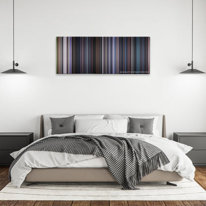 The 6th Day color palette canvas above a bed, between two black pendant lamps