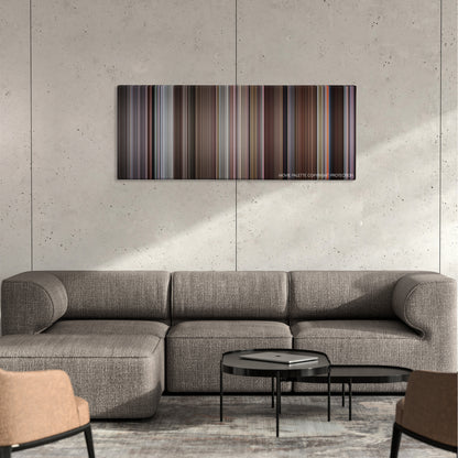 The Meaning of Life color palette canvas on a concrete wall above a gray sectional sofa