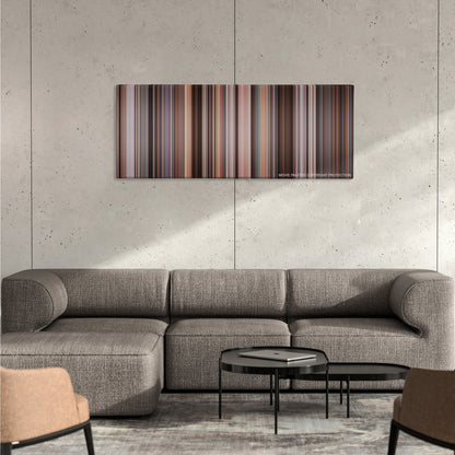 The Wolf of Wall Street color palette canvas on a concrete wall above a gray sectional sofa