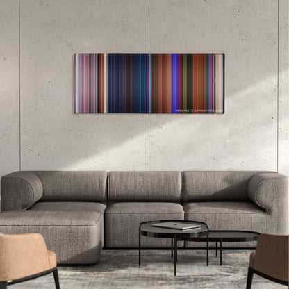 Journey to the Center of the Earth color palette canvas on a concrete wall above a gray sectional sofa