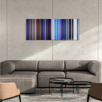 Frozen color palette canvas on a concrete wall above a gray sectional sofa