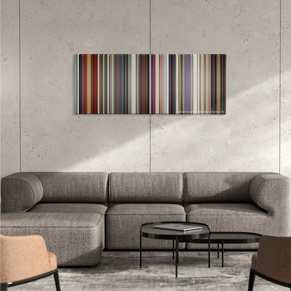 A Star Is Born color palette canvas on a concrete wall above a gray sectional sofa