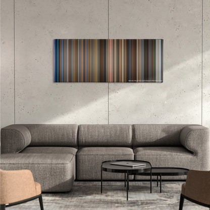 Catch Me If You Can color palette canvas on a concrete wall above a gray sectional sofa