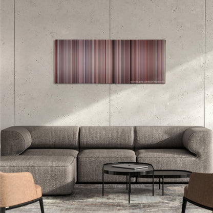 The Breakfast Club color palette canvas on a concrete wall above a gray sectional sofa
