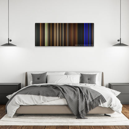 Lights Out color palette canvas above a bed, between two black pendant lamps