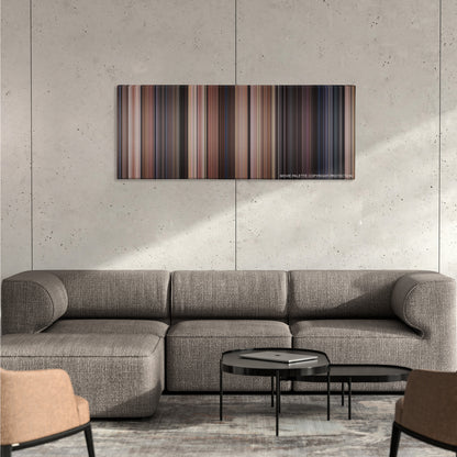 Back to the Future color palette canvas on a concrete wall above a gray sectional sofa