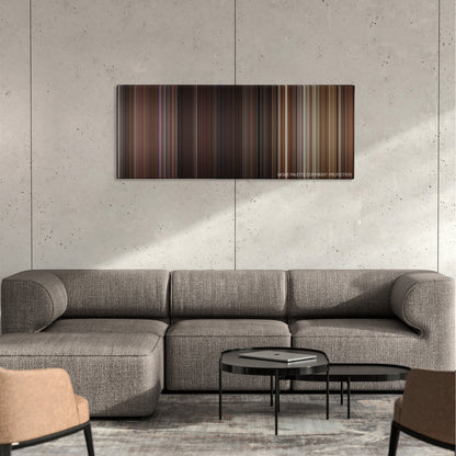 Red Eye color palette canvas on a concrete wall above a gray sectional sofa