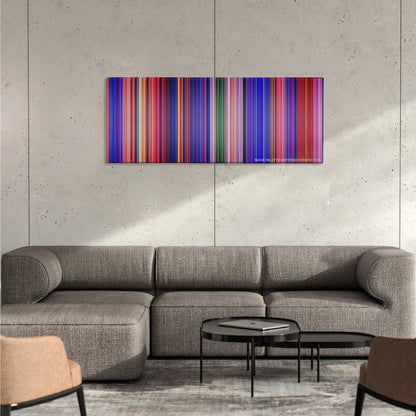 Aladdin color palette canvas on a concrete wall above a gray sectional sofa