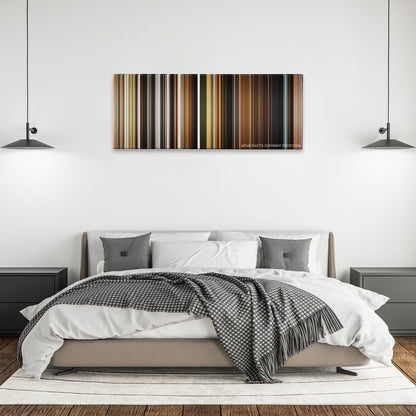 The Visit color palette canvas above a bed, between two black pendant lamps