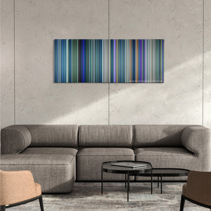 Avatar color palette canvas on a concrete wall above a gray sectional sofa