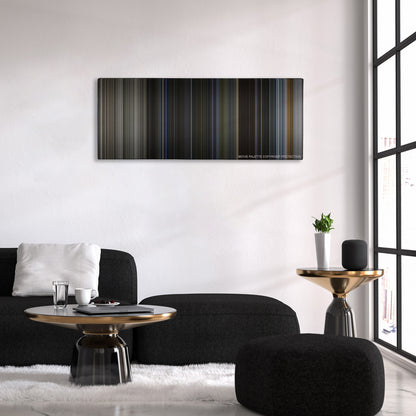Bright color palette canvas above a black sofa with a gold-topped table