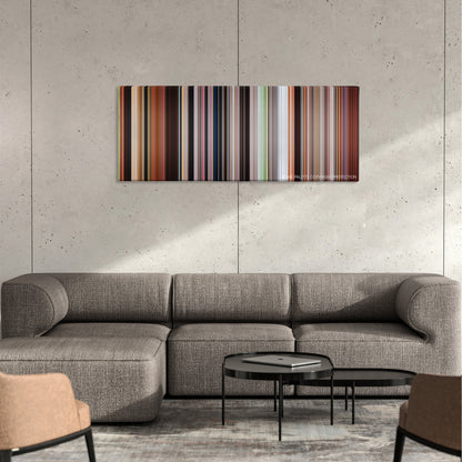 Mulan color palette canvas on a concrete wall above a gray sectional sofa