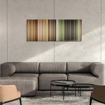 The Wizard of Oz color palette canvas on a concrete wall above a gray sectional sofa