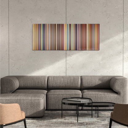 The Fifth Element color palette canvas on a concrete wall above a gray sectional sofa