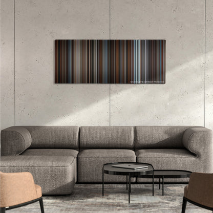Inception color palette canvas on a concrete wall above a gray sectional sofa