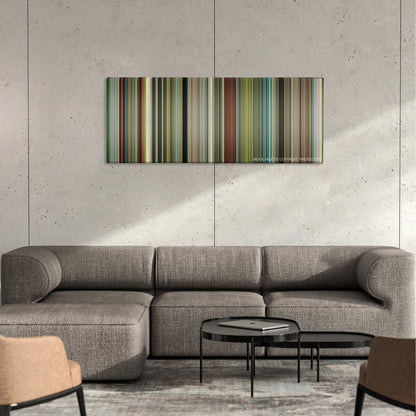 Hunt for the Wilderpeople color palette canvas on a concrete wall above a gray sectional sofa