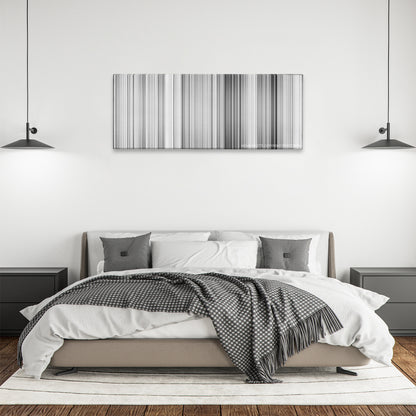 The Kid color palette canvas above a bed, between two black pendant lamps