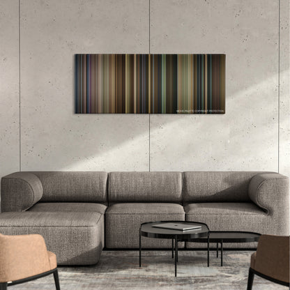 Dil Bechara color palette canvas on a concrete wall above a gray sectional sofa