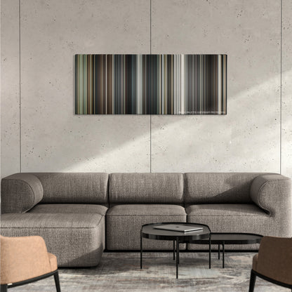 Interstellar color palette canvas on a concrete wall above a gray sectional sofa