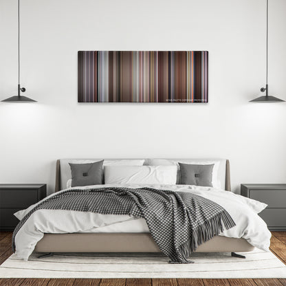 The Meaning of Life color palette canvas above a bed, between two black pendant lamps