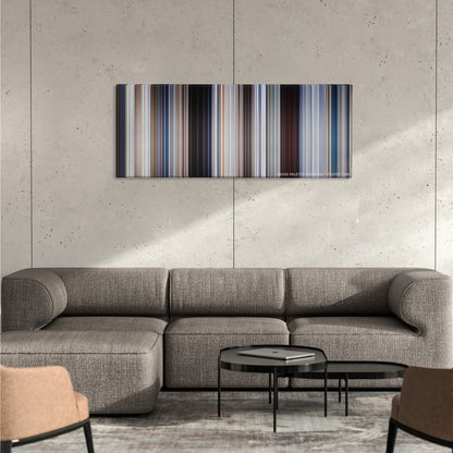 Jaws color palette canvas on a concrete wall above a gray sectional sofa
