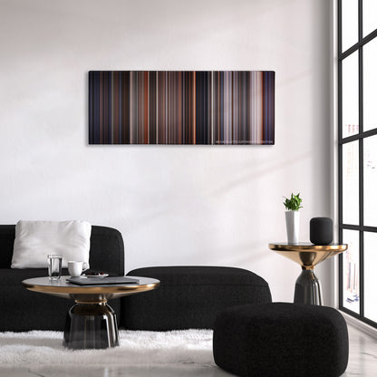 E.T. the Extra-Terrestrial color palette canvas above a black sofa with a gold-topped table