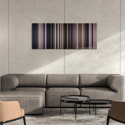 Monster color palette canvas on a concrete wall above a gray sectional sofa