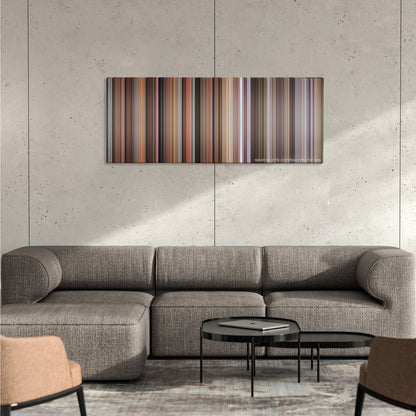 Old School color palette canvas on a concrete wall above a gray sectional sofa
