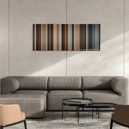 Los Idus de Marzo color palette canvas on a concrete wall above a gray sectional sofa