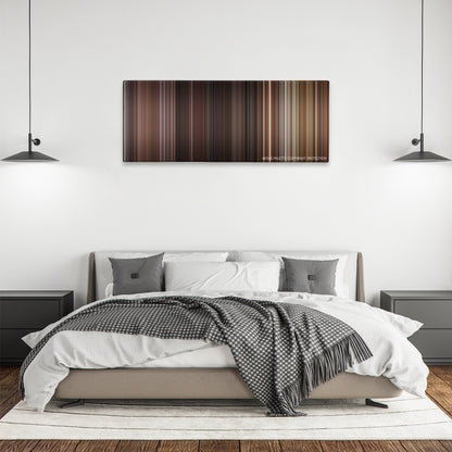 Red Eye color palette canvas above a bed, between two black pendant lamps