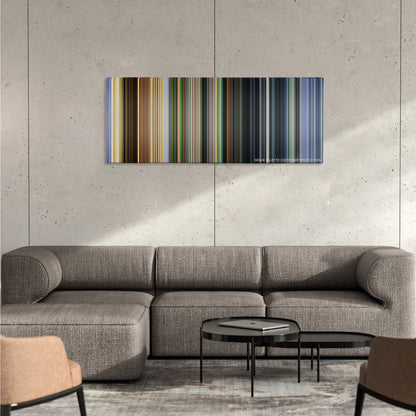 City of God color palette canvas on a concrete wall above a gray sectional sofa