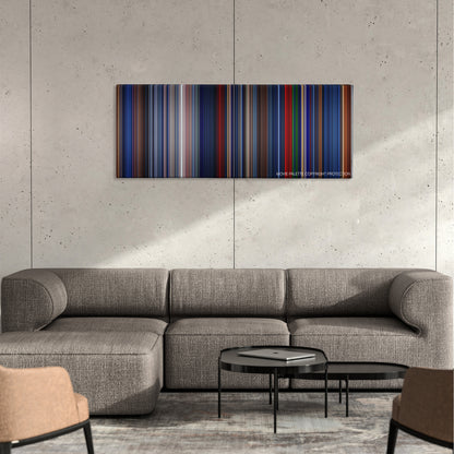 Freddy vs. Jason color palette canvas on a concrete wall above a gray sectional sofa