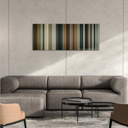 The Intouchables color palette canvas on a concrete wall above a gray sectional sofa