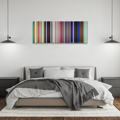 Moana color palette canvas above a bed, between two black pendant lamps