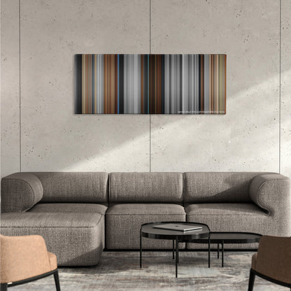 American History X color palette canvas on a concrete wall above a gray sectional sofa