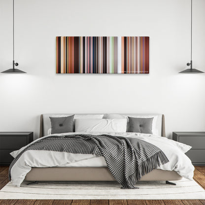 Mulan color palette canvas above a bed, between two black pendant lamps