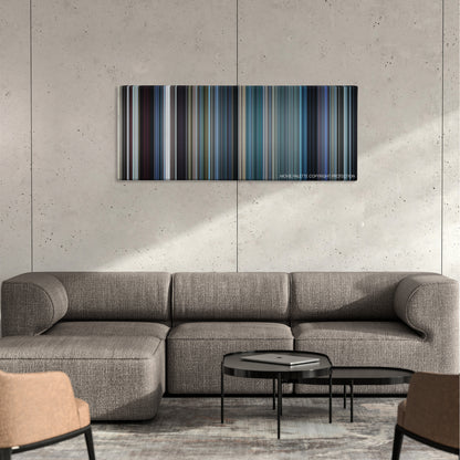 The French Connection color palette canvas on a concrete wall above a gray sectional sofa